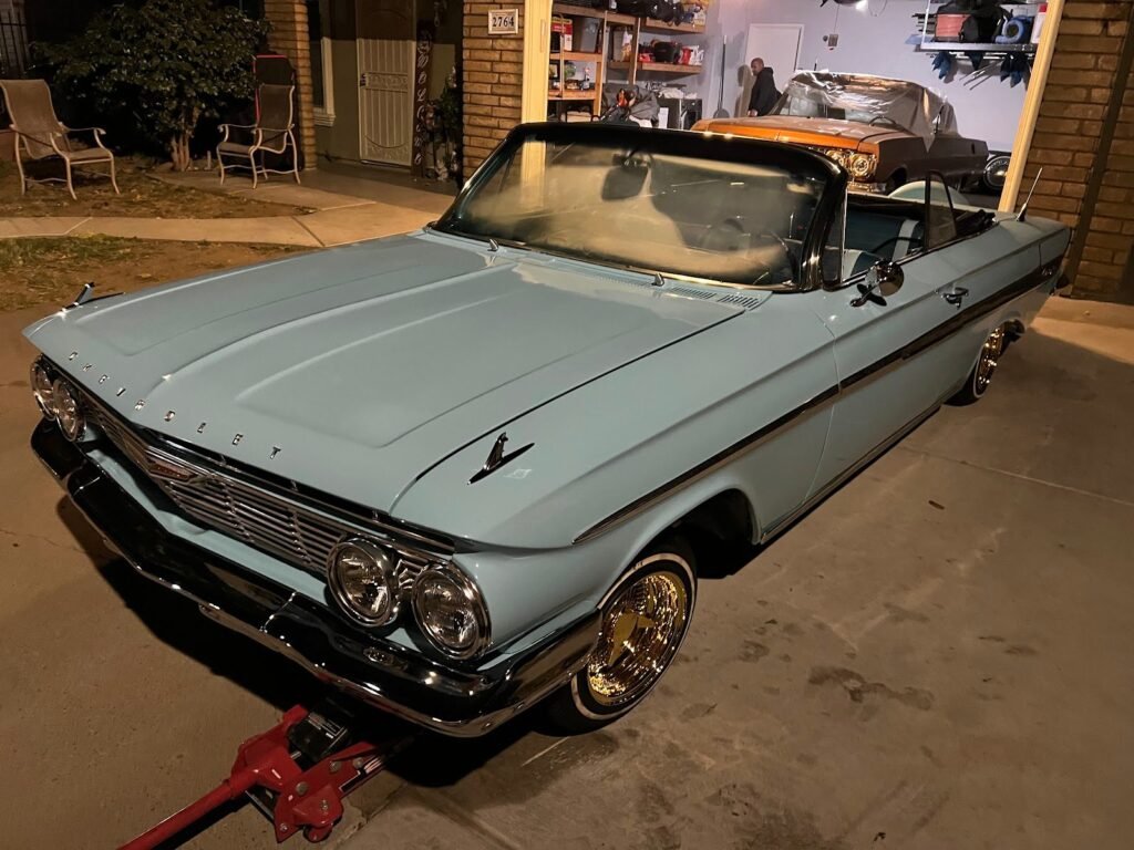 Classic Chevrolet Impala loaded on a flatbed for special vehicle towing