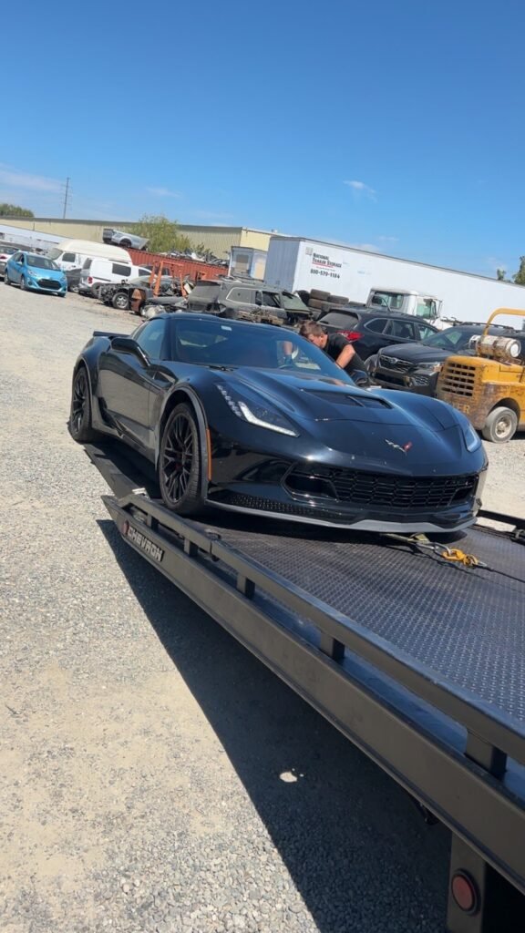 Low-clearance Corvette sports car ready for flatbed towing