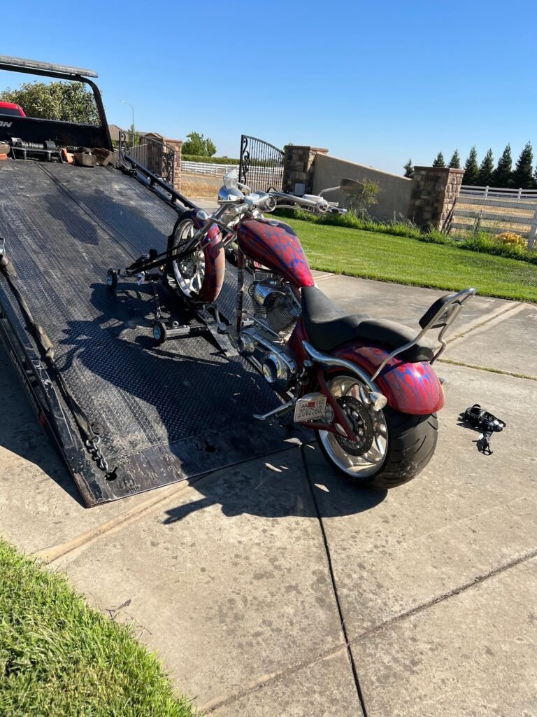 Motorcycle strapped to a flatbed for motorcycle towing in Sacramento