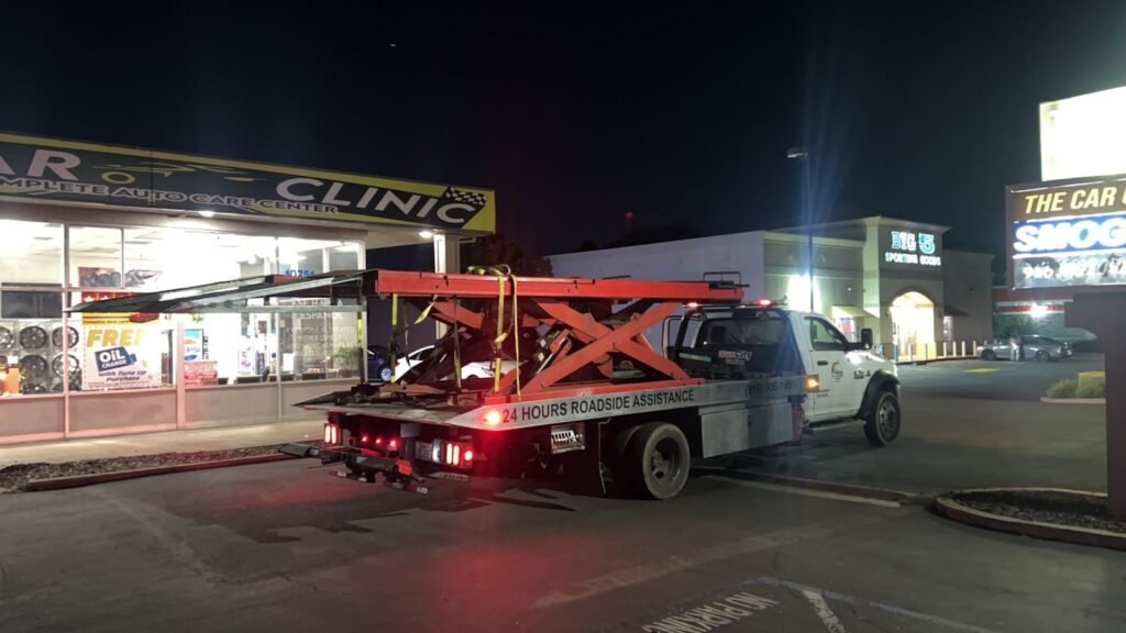 Sun City Towing truck working a nighttime emergency tow