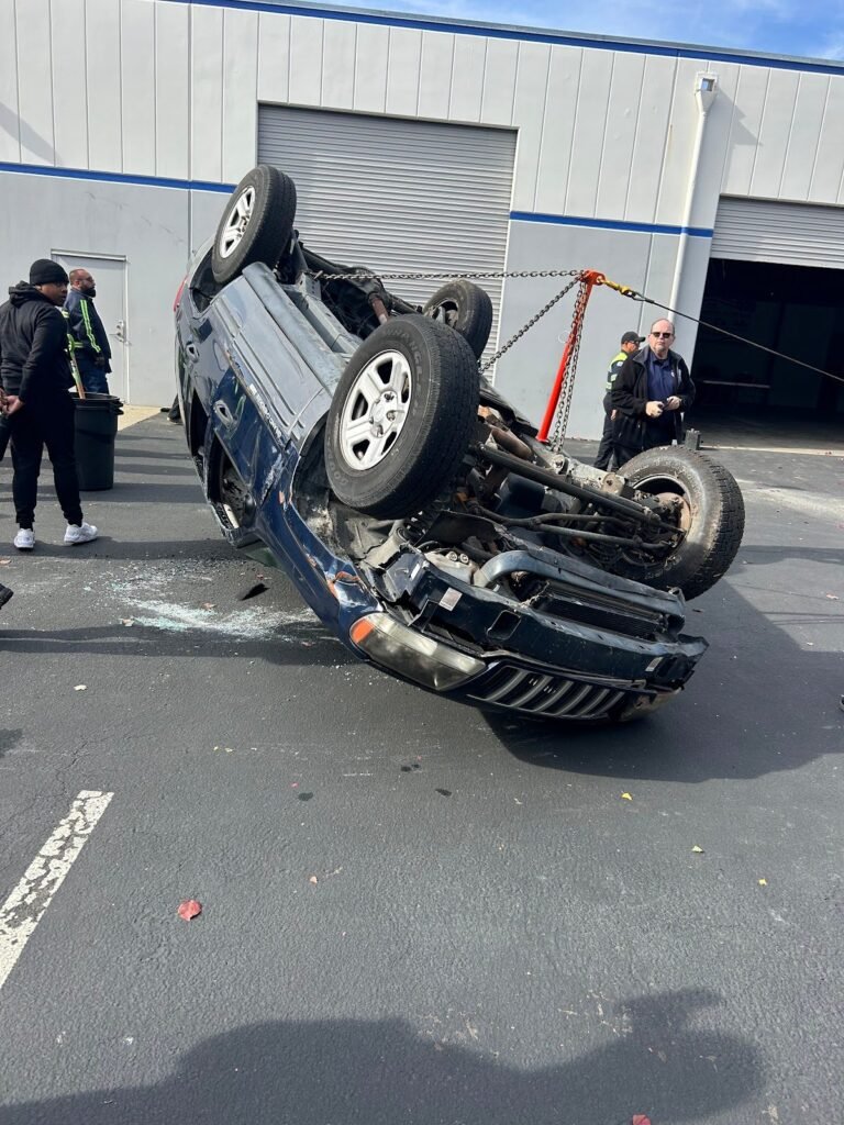 Overturned vehicle at an accident scene before recovery