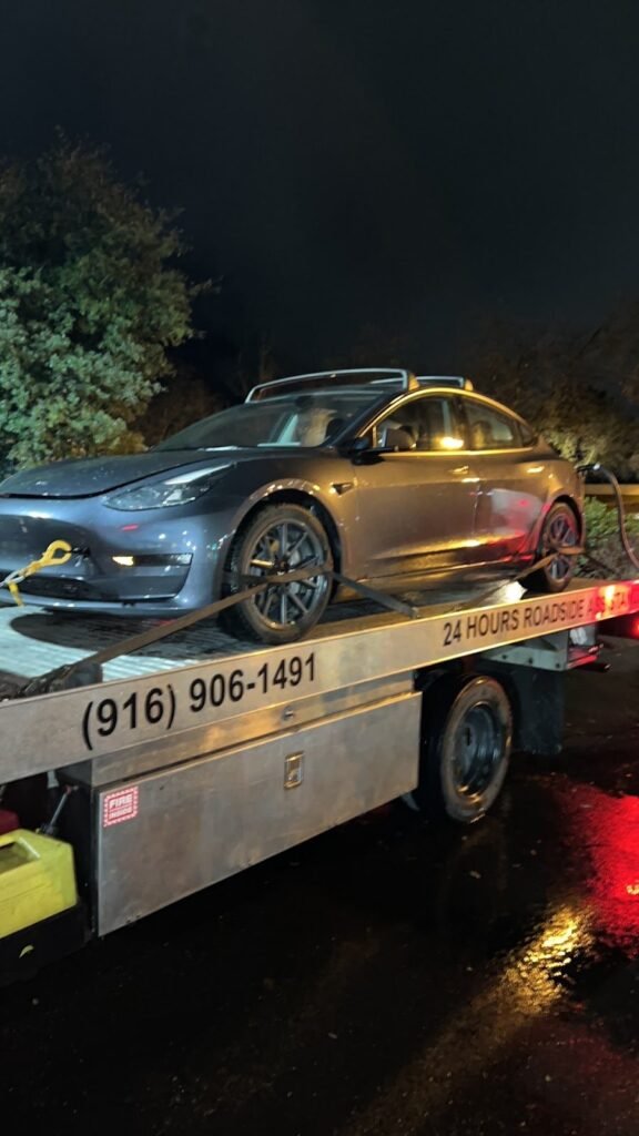 Tesla Model 3 on a flatbed for electric vehicle towing