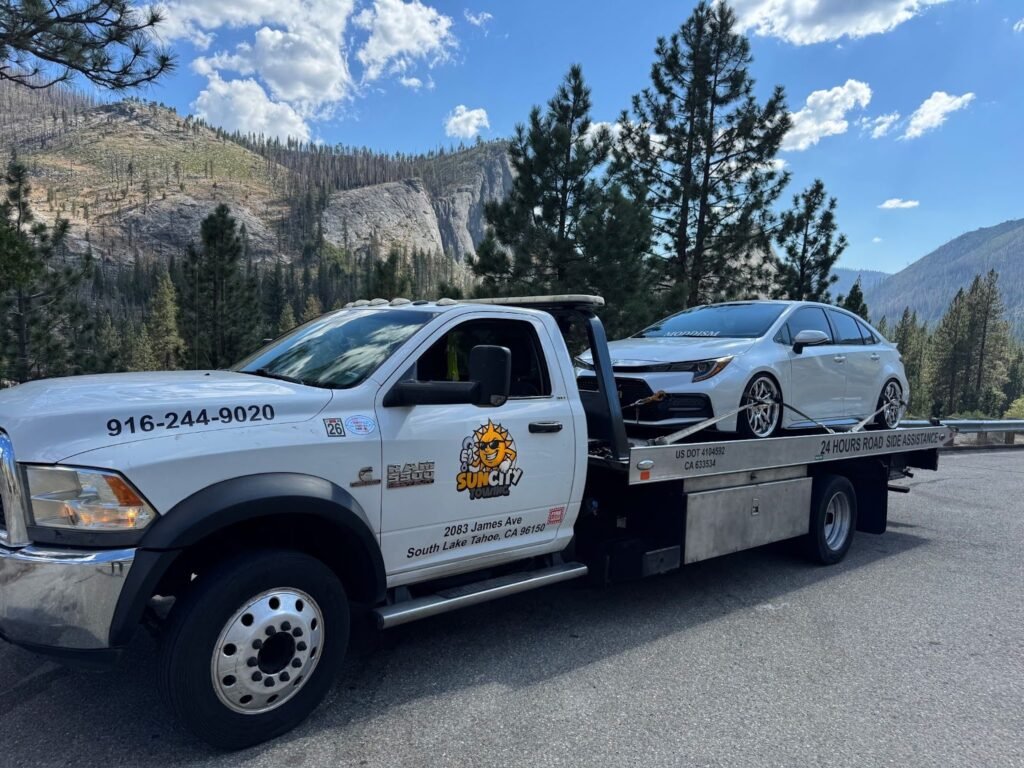 Sun City Towing flatbed with a car on board in South Lake Tahoe